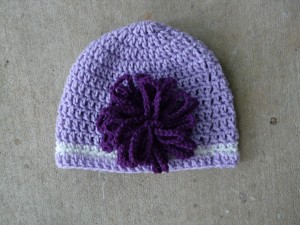 Reproduction of the Elle Woods hat with large crocheted chrysanthemum
