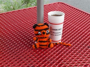 Boo-Boo enjoyes a diet coke while waiting for a break in the rain