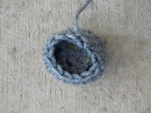 Top view of the body of the lemur-to-be with mini pony beads weighting the bottom