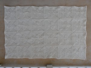 The nearly completed textured squares afghan